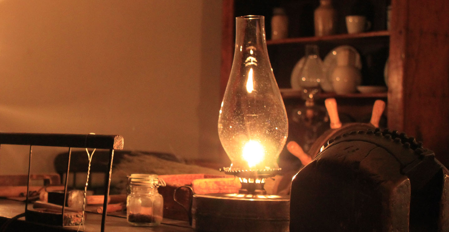 a kerosene lamp lights up a room at Black Creek Pioneer Village