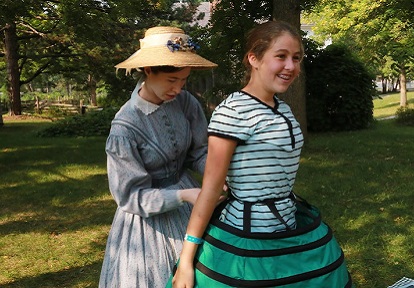 girl visits dress-up station during Black Creek home school day