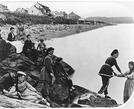 archival photograph of a Victorian family enjoying a vacation by the lakeside in 1870