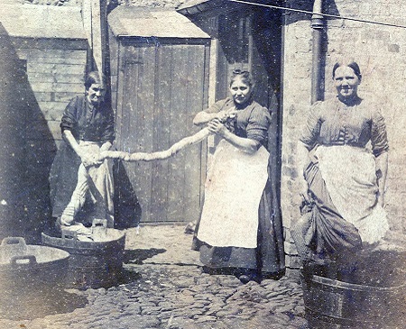 archival photograph of women doing laundry