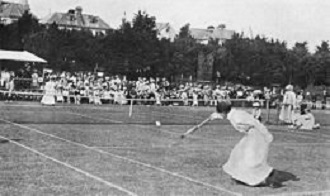 1898 photograph of tennis champion Charlotte Cooper Sterry in action