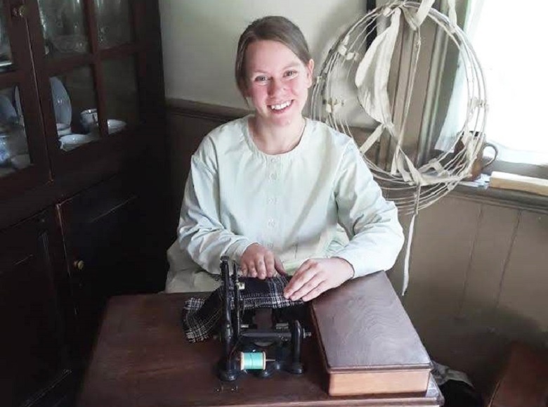 a seamstress at work sewing clothes