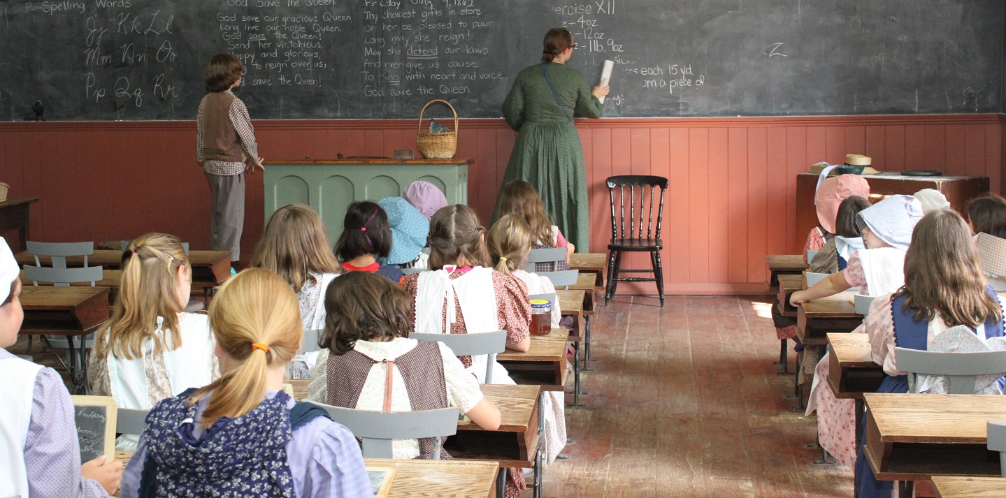 students experience lessons in a traditional 19th century school house