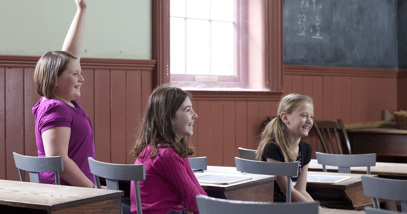 students experience lessons in a traditional 19th century school house