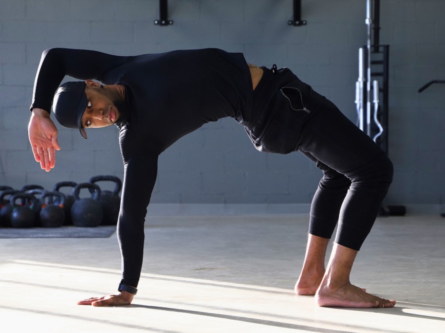 Flow Body workshop instructor demonstrates an animal flow pose